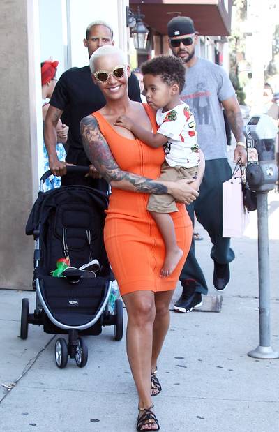 Bash and Mommy - Amber Rose carries her son Sebastian in her arms as she goes shopping in Los Angeles.(Photo: WENN.com)