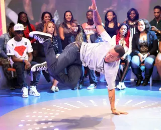 Hand Stand - Dancer Sawandi Wilson shows his strength while on 106. (Photo: Bennett Raglin/BET/Getty Images for BET)