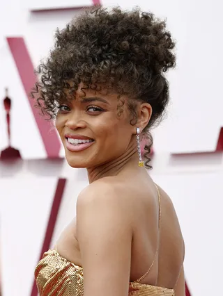 Andra Day - Andra Day is such a natural beauty. She wore her natural curls pulled up into a loose ponytail framing her face perfectly. her glam matches her Vera Wang gown perfectly. (Photo by Chris Pizzelo-Pool/Getty Images)
