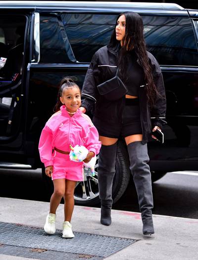 Ponytail Bone-Straight &amp; Snatched For Her 5th Birthday - North West out and about with her mom, Kim K, celebrating her 5th birthday in style. Wearing a hot pink Adidas set and candy choker. (Photo: James Devaney/GC Images)