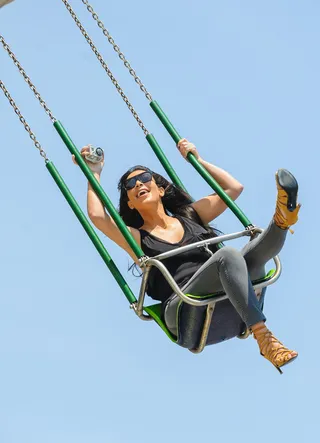 Up, Up and Away - Kim Kardashian rides on the flying swings at the amusement park at the Jersey Shore in New Jersey.&nbsp;(Photo: Smith/Mejia / Splash News)