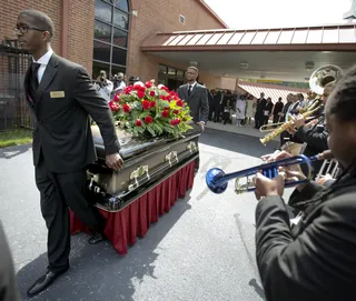 Gone Too Soon - Pallbearers carry the casket of Chris Kelly following his funeral service at Jackson Memorial Baptist Church. (Photo: AP Photo/David Goldman)