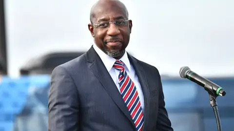 STONECREST, GEORGIA - DECEMBER 28:  Georgia Democratic Senate candidate Raphael Warnock speaks onstage during the "Vote GA Blue" concert on December 28, 2020 in Stonecrest, Georgia. (Photo by Paras Griffin/Getty Images)