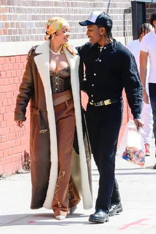 Love Is In The Air! - Things are definitely heating up between&nbsp;Rihanna and A$AP Rocky. The couple were later spotted by paparazzi taking a stroll in NYC. While filming arm-in-arm on a mystery music video shoot, the fashionable duo got super close as gazed into each other's eyes. So sexy! (Photo by Raymond Hall/GC Images) (Photo by Raymond Hall/GC Images)