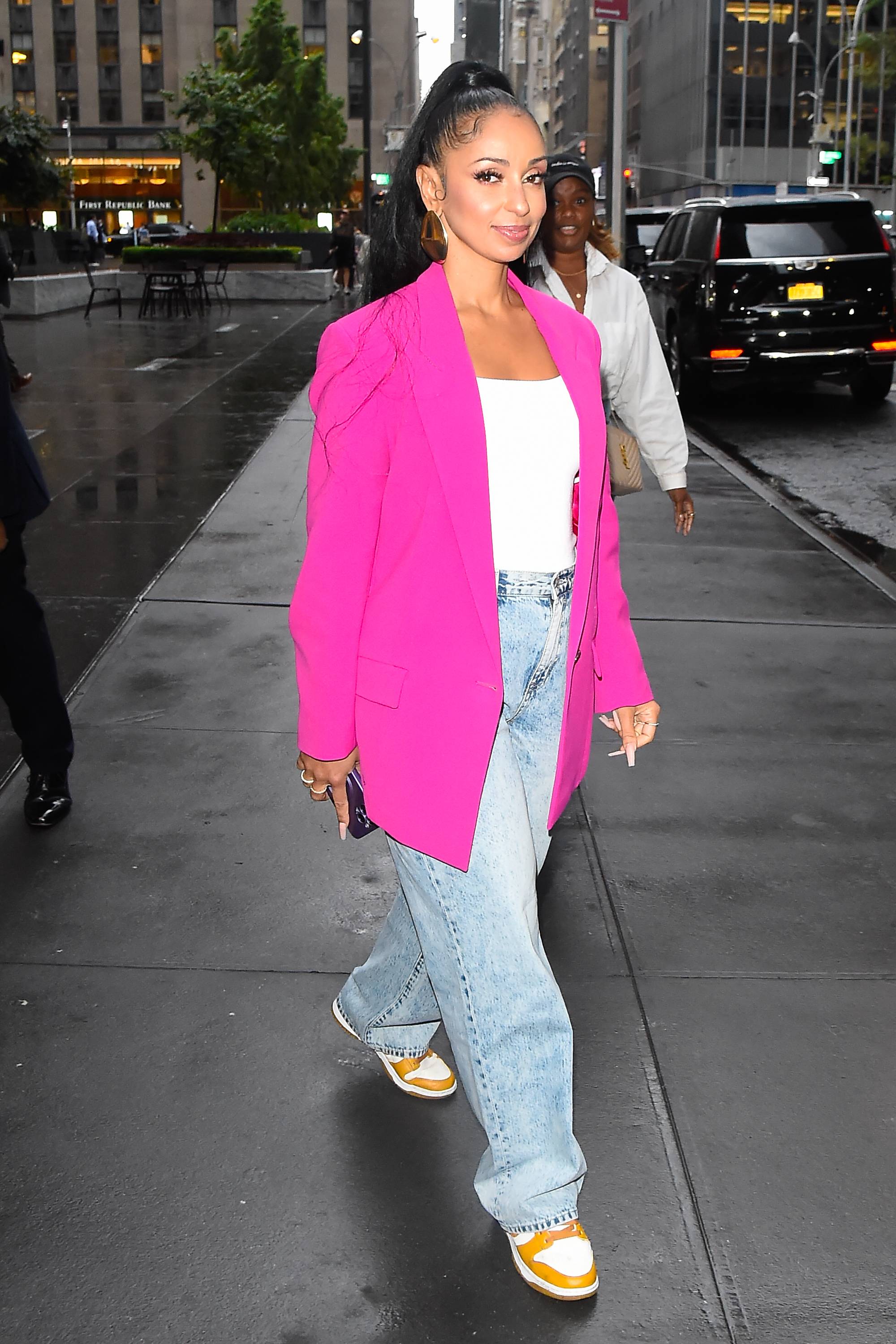 Wendy Williams looks glam with bright pink Gucci shirt and