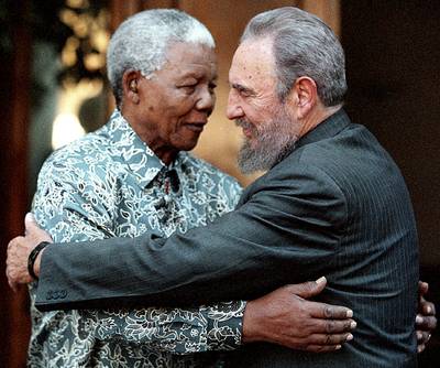 Revolutionary Leaders - In 2001, Mandela welcomed former Cuban President Fidel Castro, who visited his home in Johannesburg, in 2001.&nbsp;(Photo: REUTERS/Chris Kotze/Files)