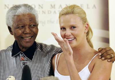 Stars Align - In 2004, Oscar-winning actress and South Africa native Charlize Theron wiped away tears during her special meeting with Mandela in Johannesburg, where the esteemed leader congratulated her on her achievement.&nbsp;(Photo: Naashon Zalk/Getty Images)
