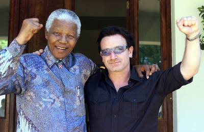 A Beautiful Day With Bono - Nelson Mandela shared a moment with U2 front man Bono at his Johannesburg home in 2002.&nbsp;(Photo: REUTERS/Juda Ngwenya JN/AA)