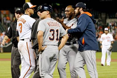 MLB to Look Into Umpire Touching Player’s Face - When benches cleared after Baltimore Orioles pitcher Bud Norris hit Detroit Tigers outfielder Torii Hunter in the ribs during the eighth inning of their game Monday night, umpire Paul Nauert briefly touched Hunter’s face. That contact is subject to a Major League Baseball suspension if they see it fit, although Hunter isn’t taking it seriously. “If MLB came to me (to ask about Nauert), I wouldn’t even talk to them,” Hunter told ESPN. “That’s my guy.”(Photo: Patrick Smith/Getty Images)
