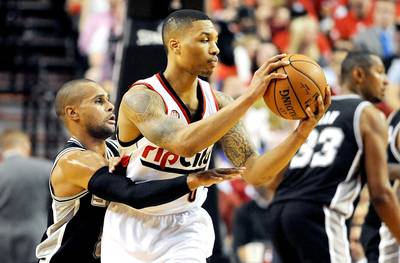 Lillard, Blazers Avoid Elimination - Damian Lillard scored 25 points to keep hope alive for the&nbsp;Portland Trail Blazers in the Western Conference semifinals. The Blazers avoided elimination with a 103-92 victory over the San Antonio Spurs in Game 4 on Monday night. They trail the Spurs, 3-1, in the series.(Photo: Steve Dykes/Getty Images)