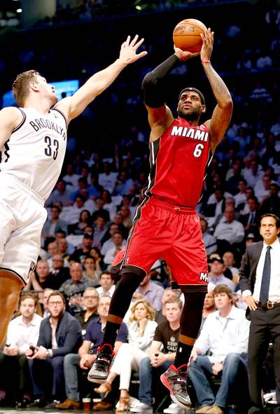 LeBron James Scores 49, Heat Up 3-1 on Nets - Be careful what you ask for. After Paul Pierce said he wanted to guard LeBron James, King James proceeded to punish his rival with 49 points to lead the two-time defending champion Miami Heat to a 102-96 victory over the Brooklyn Nets on Monday night (May 12). With the Game 4 victory Miami now owns a commanding 3-1 series lead in the Eastern Conference semifinal.(Photo: Elsa/Getty Images)