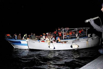 Boat Carrying Migrants Sinks in Mediterranean Sea - A boat traveling from Libya and carrying migrants sank in the Mediterranean and left at least 14 people dead. Two hundred people were rescued by the Italian navy. &nbsp;(Photo: Giuseppe Lami/Landov/EPA)