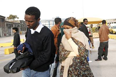 African Migrants Rescued in Greece - A total of 32 migrants who survived a boat capsizing near Turkey arrived at the port of Piraeus, Greece, Monday. Most of the survivors came from Somalia and Syria. (Photo: Petros Giannakouris/AP Photo)