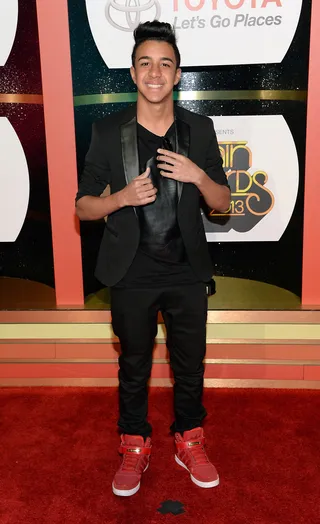 Miguelito - Somebody gave the singer the memo; red kicks add a dash of color and style to any look. Namely his black-on-black head-to-pant look.  &nbsp;(Photo: Jason Kempin/Getty Images for BET)