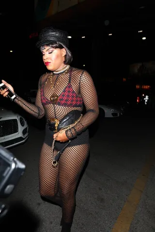 Biker Chic - EJ attended Demi Lovato's Halloween party as a Goth biker. He wore an all-black fishnet bodysuit with black shorts and a red plaid bra. (Photo: Backgrid)&nbsp;&nbsp; (Photo: Backgrid)