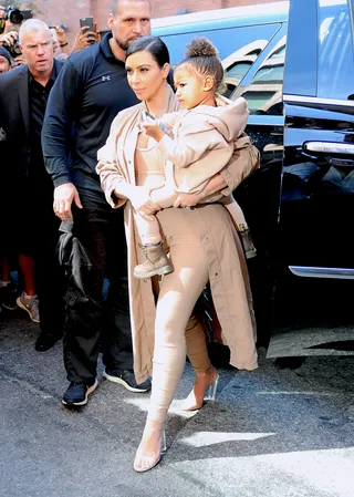 Mommy and Me - Kim Kardashian and&nbsp;North West arrive to Kanye West's Yeezy Season Two show in NYC wearing matching ensembles.&nbsp;(Photo: Splash News)