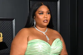 Lizzo's glam was so chic! She rocked her hair in a sleek middle part style that flowed down her back.&nbsp; - (Photo: Getty Images)