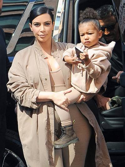 Baby Yeezus - North West takes Kanye West's Yeezy Season 2 Spring 2016 show in New York wearing duds by dad of course. Her and Kim do mommy-and-me style the Ye' way.(Photo: Splash News)