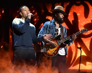 Strumming Along - We may be accustomed to seeing John Legend in front of a piano, but this year's show will see him also blend his smooth vocals with a little help from the guitar.&nbsp;(Photo: Kevin Winter/Getty Images for BET)