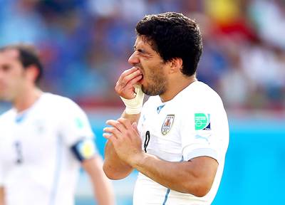 Luis Suarez Bites Opponent During World Cup - Uruguay soccer star Luis Suarez literally took a bite out of Italy’s Giorgio Chiellini’s shoulder during their World Cup match this past summer, shocking the global sports audience and World Wide Web alike. FIFA responded by banning Suarez for four months. Bite on that, Luis!(Photo: Clive Rose/Getty Images)