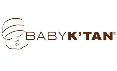 Baby K’Tan Package Sparks Outrage on Social Media - A photo of a baby sling manufactured by Baby K’Tan, went viral for its alleged stereotypical messages on its packaging. One package features a single Black woman with a baby. But another package features a white woman with a baby with a man next to her.&nbsp;(Photo: Baby K'tan)