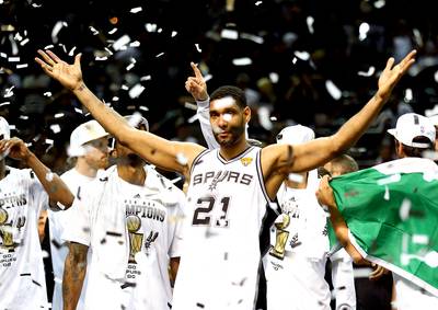 Tim Duncan Exercises Option With Spurs - No surprise here. After winning his fifth NBA championship, Tim Duncan exercised his $10.3 million player option Monday to re-up with the San Antonio Spurs. Duncan, 38, averaged 15.1 points and 9.7 rebounds per game this season.&nbsp;(Photo: Andy Lyons/Getty Images)