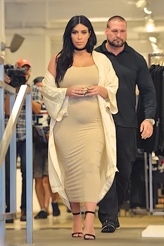 Bumpin' - Kim Kardashian shows her baby bump in a nude tube dress as she does a bit of shopping while out and about in NYC.&nbsp;(Photo: RGK, PacificCoastNews)