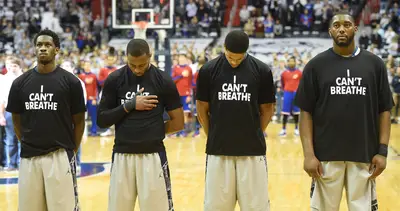 Georgetown Men's Basketball Team - Watching their pro counterparts spark the movement earlier in the week, Georgetown University's men's basketball team also repped for Eric Garner on Wednesday night with the &quot;I Can't Breathe&quot; T-shirts during warm-ups before their game against Kansas.&nbsp;(Photo: Jonathan Newton / The Washington Post via Getty Images)