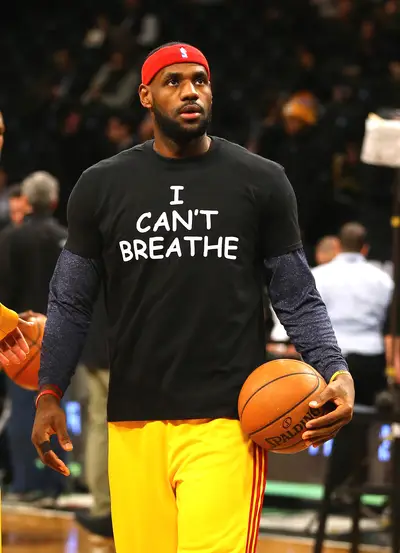 LeBron James - LeBron James&nbsp;followed in Derrick Rose's&nbsp;lead as well, wearing an&nbsp;&quot;I Can't Breathe&quot; T-shirt during warm-ups before the Cleveland Cavaliers game against the Brooklyn Nets on Monday night. Being that Brooklyn is a borough over to Staten Island, where Eric Garner died, made the gesture all the more special. Also, as King James took the stand inside the Nets' Barclays Center, hundreds of protesters had a die-in demonstration in the Brooklyn streets outside of it.(Photo: Al Bello/Getty Images)