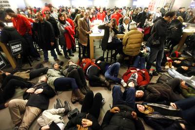 No Business as Usual - There was no business as usual for businesses in New York City Friday (Dec. 5) as protesters staged a die-in in an Apple store and also at the Macy's in Herald Square.(Photo: AP Photo/Jason DeCrow)