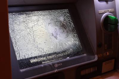 Banks Targeted by Some Protesters - An ATM shown here has been vandalized in Berkeley, California. Some protesters targeted banks in damaging property during the demonstrations. (Photo: AP Photo/Taylor Nitta)