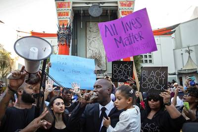 Tyrese - Tyrese&nbsp;brought his daughter, Shayla,&nbsp;along to protest police’s unapologetic use of force and the recent spate of the killing of Black males with no repercussion. Dressed in all black, the singer/actor took part in the Black Out Hollywood Rally, where they marched throughout the streets of Los Angeles and laid across Hollywood Boulevard to bring attention to this cause. &nbsp;(Photo: Patrick T. Fallon/Landov)&nbsp;