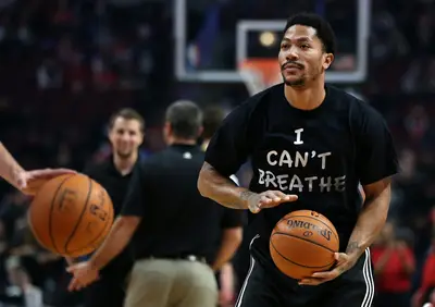 Derrick Rose - Derrick Rose can be credited in starting the movement for athletes, rocking a black &quot;I Can't Breath&quot; T-shirt during pre-game warm-ups before his Chicago Bulls hosted the Golden State Warriors on Saturday night. Immediately, media picked up on it and fellow athletes like Reggie Bush and LeBron James thought it was cool, before following suit themselves. Props to D. Rose.(Photo: Chris Sweda/Chicago Tribune/TNS/LANDOV)