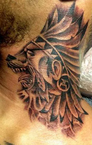 Indian Wolf - &quot;An Indian chief transforming into a wolf&quot; can be found on the left side of Chris Brown's neck.   (Photo: Chris Brown via Twitter)