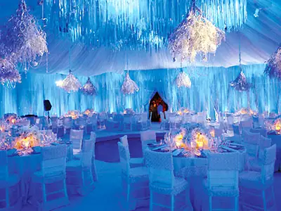 Winter Wonderland - If winter is your favorite season and you love the snow, then consider a winter wonderland-themed reception. If you have a winter wedding, you'll have to be wed indoors, but enjoy the ambiance of how peaceful and perfect snow is in your own personal winter wonderland. Have your tables and chairs decked out in all white, make sure that your chandeliers are designed like icicles, and make sure that glitter is abundant.  (Photo: Courtesy of Bride Universe)