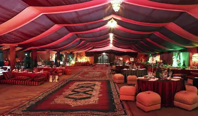 Arabian Nights - If the bride wants to be Princess Jasmine and sees her groom as Aladdin, then this Arabian Nights theme would be perfect for the reception. With colorful drapes, ottomans and a dimly lit decor, you'll feel as if you're going to take a magic carpet ride at any second!  (Photo: Courtesy of Harem Nights)