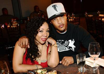 Tiny and T.I. - T.I. and Tiny have been labeled the &quot;Hip Hop Huxtables&quot; by the masses and for good reason. Now, in the second season of T.I. &amp; Tiny:The Family Hustle, the world has officially fallen in love with the Harris family. Despite whatever preconceived notions folks have had about T.I., his love, dedication and support that he gives to his family make him quite possibly one of the most lovable fathers out there. Oh, and this couple is S-E-X-Y! (Photo: Rick Diamond/Getty Images)