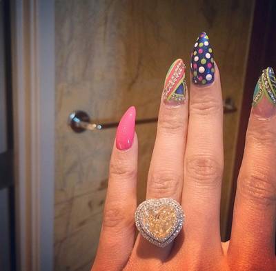 Nicki Minaj - Nicki is killing us with this engagement mani! When you’ve got a rock like hers, why not coordinate it with some equally colorful, blinged-out tips?(Photos: Nicki Minaj via Instagram)