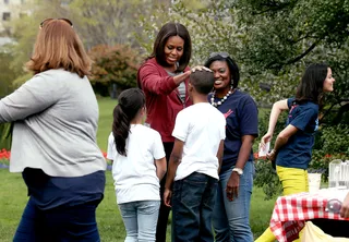 Welcome! - The first lady greets students before they begin planting vegetables.(Photo: Mark Wilson/Getty Images)