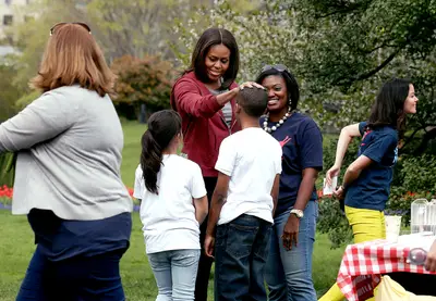 Welcome! - The first lady greets students before they begin planting vegetables.(Photo: Mark Wilson/Getty Images)