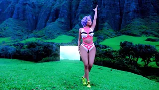 “Starships” - This look right here is the total package — from the MC’s curled lavender bob to her sexy cutout one-piece that hugs her bod like a glove.   (Photo: Cash Money Records)