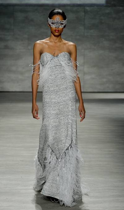 B. Michael America - The veteran designer tells BET.com he was inspired by the idea of moden American elegance for his new collection, adding sublte twists on timeless shapes and finishes. He definitely nails it with this strapless feathered gown.  (Photo: Frazer Harrison/Getty Images for Mercedes-Benz)