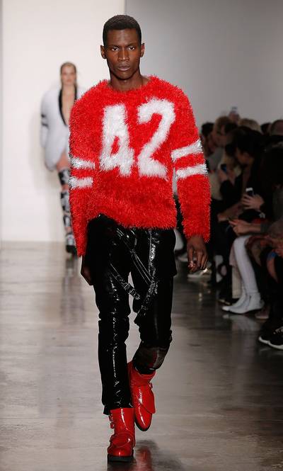 Jeremy Scott - Don’t worry fellas, Scott’s got your back, too. For you risk takers out there, this furry varsity sweater and PVC bondange pants combo is a must. (Photo: Jemal Countess/Getty Images)