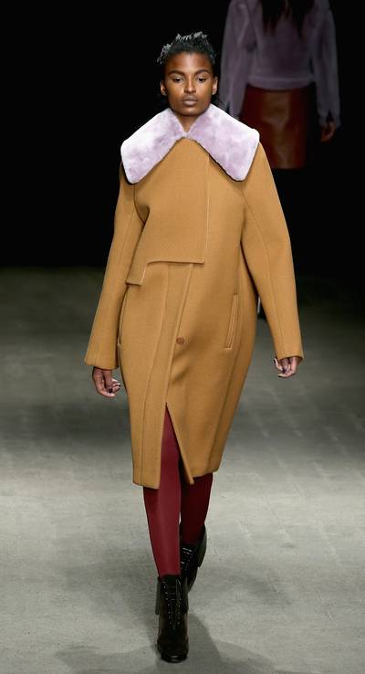 3.1 Phillip Lim - The lavender fur collar is such an unexpected pairing with this luxe camel coat, but it works to keep the overall look sassy and fun.(Photo: Neilson Barnard/Getty Images for Mercedes-Benz Fashion Week)