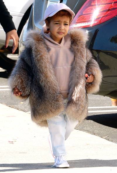 Like A Boss - Baseball cap, check. Yeezy hoodie, check. Converse pumps, check. Lollipop, check. When you can't decide what to wear, just wear everything. Check her out in LA.(Photo: Splash News)