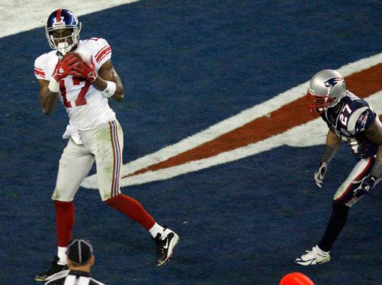 New York Giants Plaxico Burress celebrates his first quarter