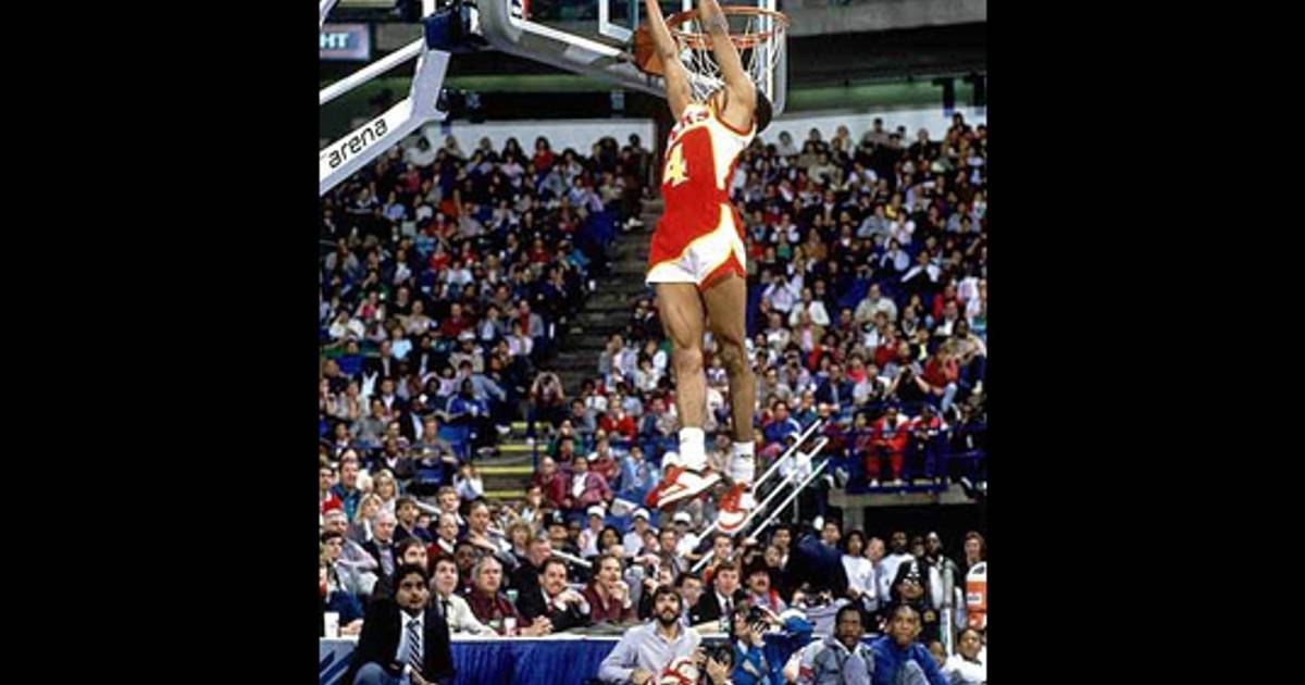 Spud Webb of the Atlanta Hawks brings the ball upcourt against the News  Photo - Getty Images