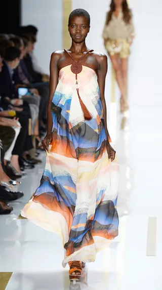 Diane Von Furstenberg Spring 2014 - A gorgeous braided neckline highlights the soothing blues and copper hues of this breezy maxi dress.  (Photo: Frazer Harrison/Getty Images for Mercedes-Benz)