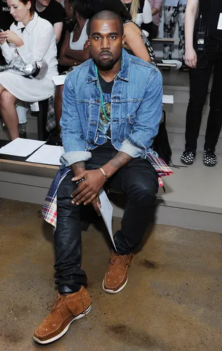 Art + Fashion - Fashion fan Kanye West is sure to have the best seat in the house at the Louise Goldin fashion show during MADE Fashion Week Spring 2014 at Milk Studios in New York City. (Photo: Ilya S. Savenok/Getty Images)