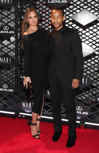 Chrissy Teigen - The model and hubby-to-be John Legend stay color coordinated in black at the Lexus Design Disrupted Fashion Event.  (Photo: Taylor Hill/Getty Images)